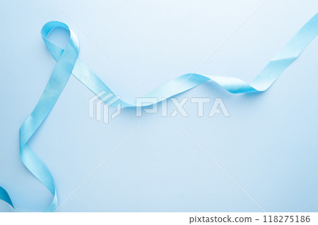 Men's health and Prostate cancer awareness campaign in November. Light blue ribbon awareness on sky blue background. Symbol for support men who living with cancer. Copy space. Men's health and Prostate cancer awareness campaign in November. Light blue ribbon awareness on sky blue background. Symbol for support men who living with cancer. Copy space. 118275186
