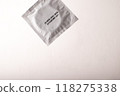 Condom on white light background. Mens contraception. Sexually transmitted diseases infections protection. Concept of birth control. Safe sex. STD. High quality photo 118275338