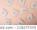 Condoms background pink. Pattern from mens contraception. Sexually transmitted diseases infections protection. Concept of birth control. Safe sex. STD. View from above. High quality photo 118275339