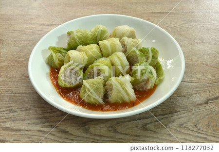 steamed Chinese cabbage sukiyaki stuffed chop pork and glass noodles on plate dressing sauce 118277032