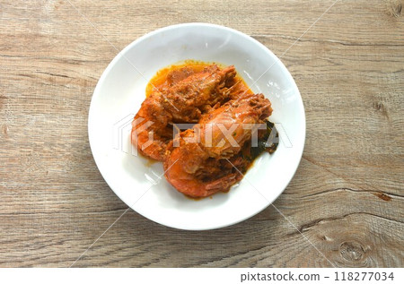 spicy stir fried river shrimp with slice grass leaf curry on plate spicy stir fried river shrimp with slice grass leaf curry on plate 118277034