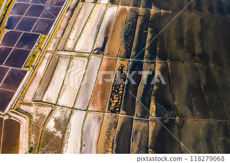Fly over seawater filled salt pans for producing sea salt on Pag Island, Croatia. Fly over seawater filled salt pans for producing sea salt on Pag Island, Croatia. 118279068