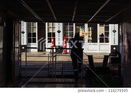 A man on a ferry while docking at a pier in Istanbul 118279305