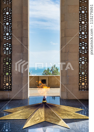 Eternal Flame at Shahidlar Monument in Baku, Azerbaijan, burning on a golden star, honoring those who died in the war 118279861
