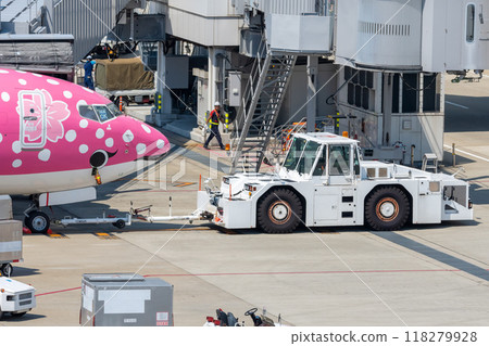 Airport vehicles: Airplane towing cars Airport vehicles: Airplane towing cars 118279928