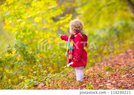 Kids playing in autumn park Kids playing in autumn park 118280221