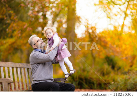 Kids playing in autumn park 118280303