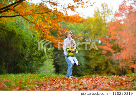 Kids playing in autumn park 118280319