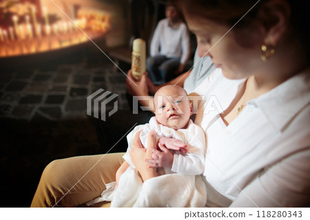 Baptism of newborn baby in Catholic church. 118280343