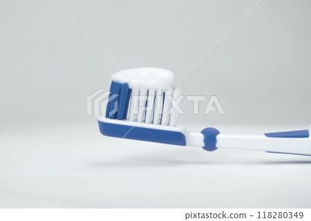 toothbrush with a toothpaste close-up. High quality photo toothbrush with a toothpaste close-up. High quality photo 118280349