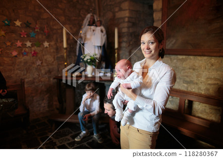 Baptism of newborn baby in Catholic church. 118280367
