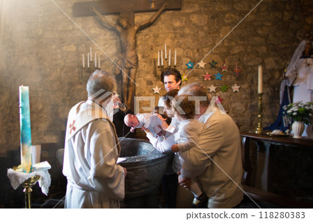Baptism of newborn baby in Catholic church. 118280383
