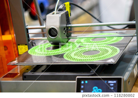 The process of printing on 3D printer. 3D printer creating model from molten plastic close-up. Molten plastic flowing of extruder and forming three-dimensional volumetric object. Additive technologies The process of printing on 3D printer. 3D printer creating model from molten plastic close-up. Molten plastic flowing of extruder and forming three-dimensional volumetric object. Additive technologies 118280802