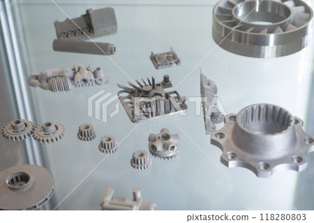Objects printed on 3D printer from metal powder using Metal Jet technology. High detailed detailing parts. Metal Jet. 3D-printed metal parts. Modern 3D printing, additive manufacturing technologies Objects printed on 3D printer from metal powder using Metal Jet technology. High detailed detailing parts. Metal Jet. 3D-printed metal parts. Modern 3D printing, additive manufacturing technologies 118280803