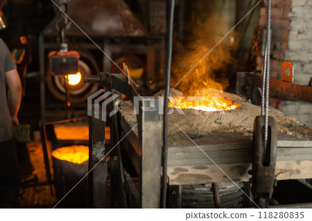 Ferrous metal billet is melted in an induction furnace closeup Ferrous metal billet is melted in an induction furnace closeup 118280835