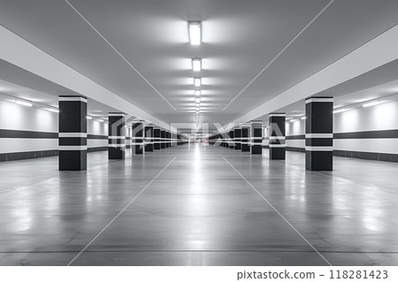 Empty underground parking lot for customers and staff with black dividing markings on columns well lit by lamps 118281423