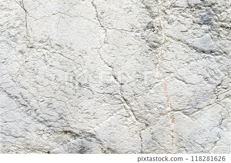 Distressed aged gray stone wall with cracks and scratches of textured abstract surface Distressed aged gray stone wall with cracks and scratches of textured abstract surface 118281626