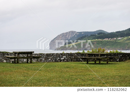 Peaceful Park by the Ocean, view to green Basque mountains from Mundaka, Spain Peaceful Park by the Ocean, view to green Basque mountains from Mundaka, Spain 118282062