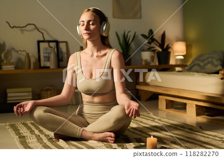 Woman listening to meditation music Woman listening to meditation music 118282270