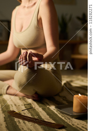 Woman practicing relaxation exercise Woman practicing relaxation exercise 118282271