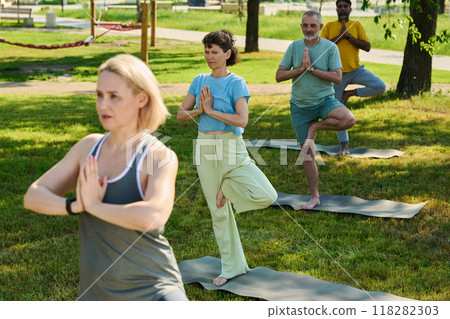 Repeating yoga exercise after trainer Repeating yoga exercise after trainer 118282303