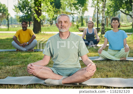 Mature people doing meditation exercises Mature people doing meditation exercises 118282320