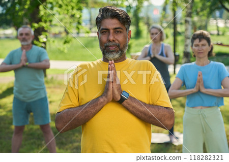 Mature multiethnic active man in t-shirt Mature multiethnic active man in t-shirt 118282321