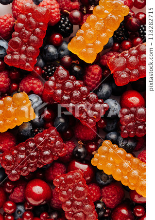 Colorful natural berry marmalade on fresh mixed fruits and berries, healthy sweet indulgence Colorful natural berry marmalade on fresh mixed fruits and berries, healthy sweet indulgence 118282715