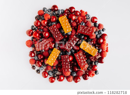 Colorful natural berry marmalade on fresh mixed fruits and berries, healthy sweet indulgence Colorful natural berry marmalade on fresh mixed fruits and berries, healthy sweet indulgence 118282718