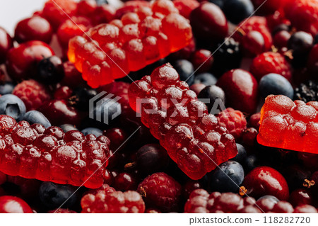Natural berry marmalade on fresh fruit and berries, perfect for advertising healthy sweet treats Natural berry marmalade on fresh fruit and berries, perfect for advertising healthy sweet treats 118282720