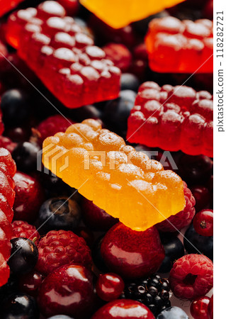 Colorful natural berry marmalade on fresh mixed fruits and berries, healthy sweet indulgence Colorful natural berry marmalade on fresh mixed fruits and berries, healthy sweet indulgence 118282721