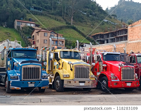 Parked cargo trucks. Trucks with the colors of the Colombian flag. Truckers strike concept. 118283109