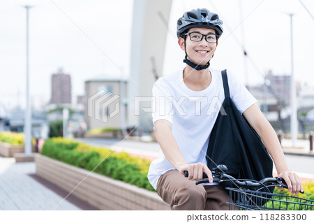 A man riding a bicycle A man riding a bicycle 118283300