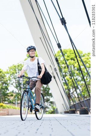 A man riding a bicycle A man riding a bicycle 118283301
