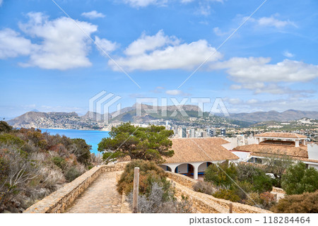 Stunning Aerial Scenery Calpe Spain Costa Blanca Beaches Penon de Ifach Rock Mediterranean Vegetation Sunny Day Tourism Destination. Idyllic Coastal Panorama Calpe Spain Azure Waters Sandy Beaches 118284464
