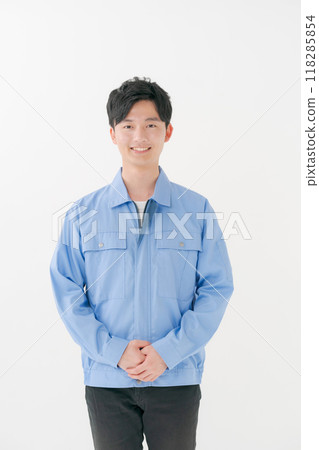 A young man wearing work clothes A young man wearing work clothes 118285854