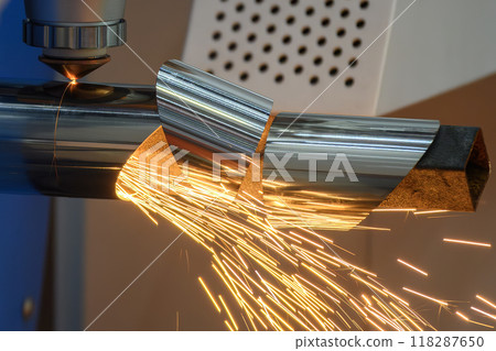 Close up scene the fiber laser cutting machine cut the stainless steel tube and sparkling light. Close up scene the fiber laser cutting machine cut the stainless steel tube and sparkling light. 118287650