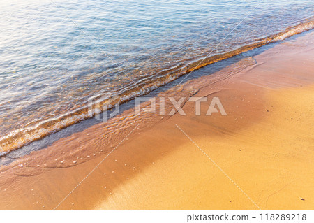Soft wave of the sea on the sandy beach. Soft wave of the sea on the sandy beach. 118289218