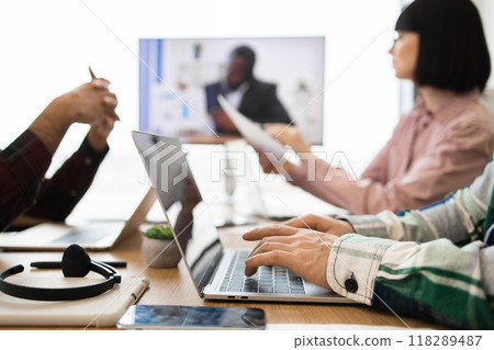 Business team working together in modern office meeting 118289487