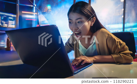 Woman surprised at computer (AI-generated image) 118290221