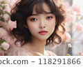 Young girl with curly hair and pink dress, surrounded by flowers. 118291866