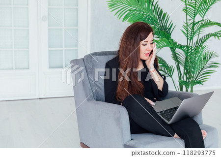 Business woman brunette working online laptop from home Business woman brunette working online laptop from home 118293775