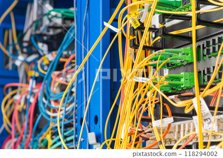 detail of server rack with fiber optic cables attached to front 118294002