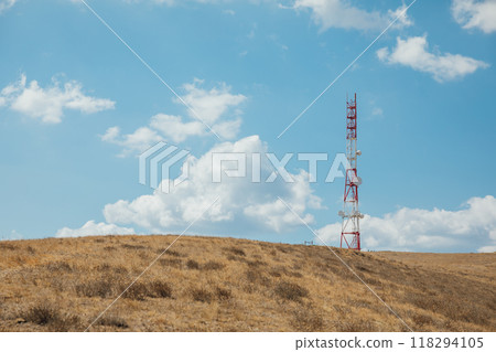 Cell tower with antennas on the top of the mountain Cell tower with antennas on the top of the mountain 118294105