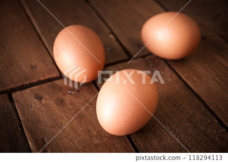 Eggs on a rustic wooden board 118294113
