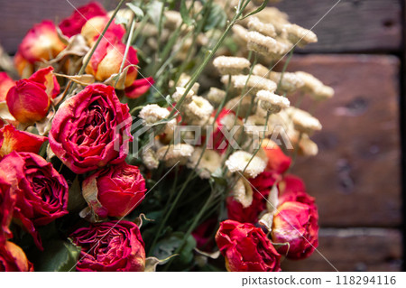 Bouquet of dried flowers on a rustic wooden board Bouquet of dried flowers on a rustic wooden board 118294116