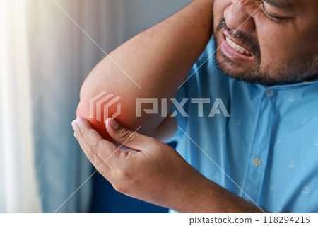 A man injured his elbow and it was swollen and red. Causes of pain include Lifting heavy objects, Gout, Rheumatoid arthritis, office syndrome, numbness, and cramp symptoms. Healthcare medical concept. A man injured his elbow and it was swollen and red. Causes of pain include Lifting heavy objects, Gout, Rheumatoid arthritis, office syndrome, numbness, and cramp symptoms. Healthcare medical concept. 118294215