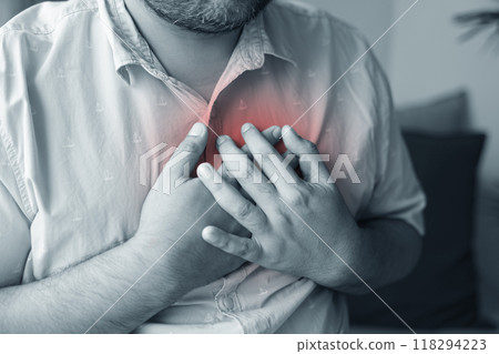A man injured his left breast. Causes of pain include Heart disease, Pleurisy, Costochondritis, Pectoral muscle inflammation, and Acid reflux disease. Healthcare medical concept. 118294223