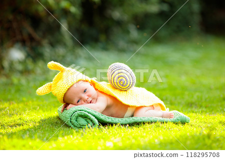 Baby in cute dress up costume. Newborn in garden. Baby in cute dress up costume. Newborn in garden. 118295708