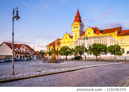 Marianske Square in Stara Boleslav glows in the evening light as the Town Hall stands majestically nearby. The quiet square invites evening strolls amid historical architecture. 118296338